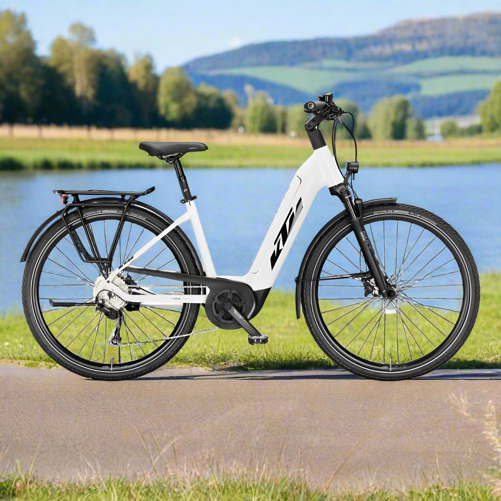 KTM Macina Tour P500 Hybrid Electric Bike By Lake In Sunshine