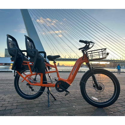 Revom C2 Cargo Electric Bike Orange With Seats In Urban Area - PEDAL & RIDE